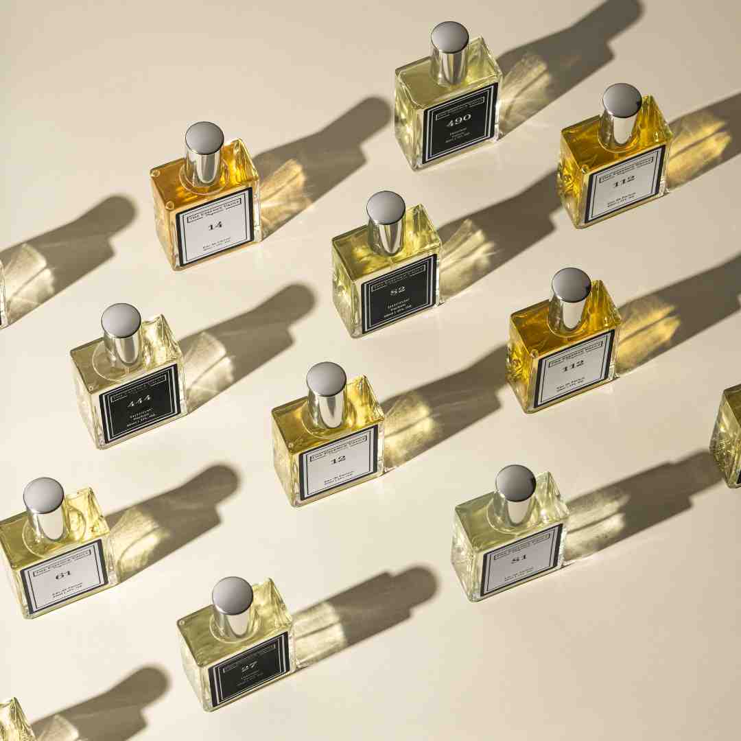 Image of several perfume bottles from the essence vault, for the blog post The History of Perfume